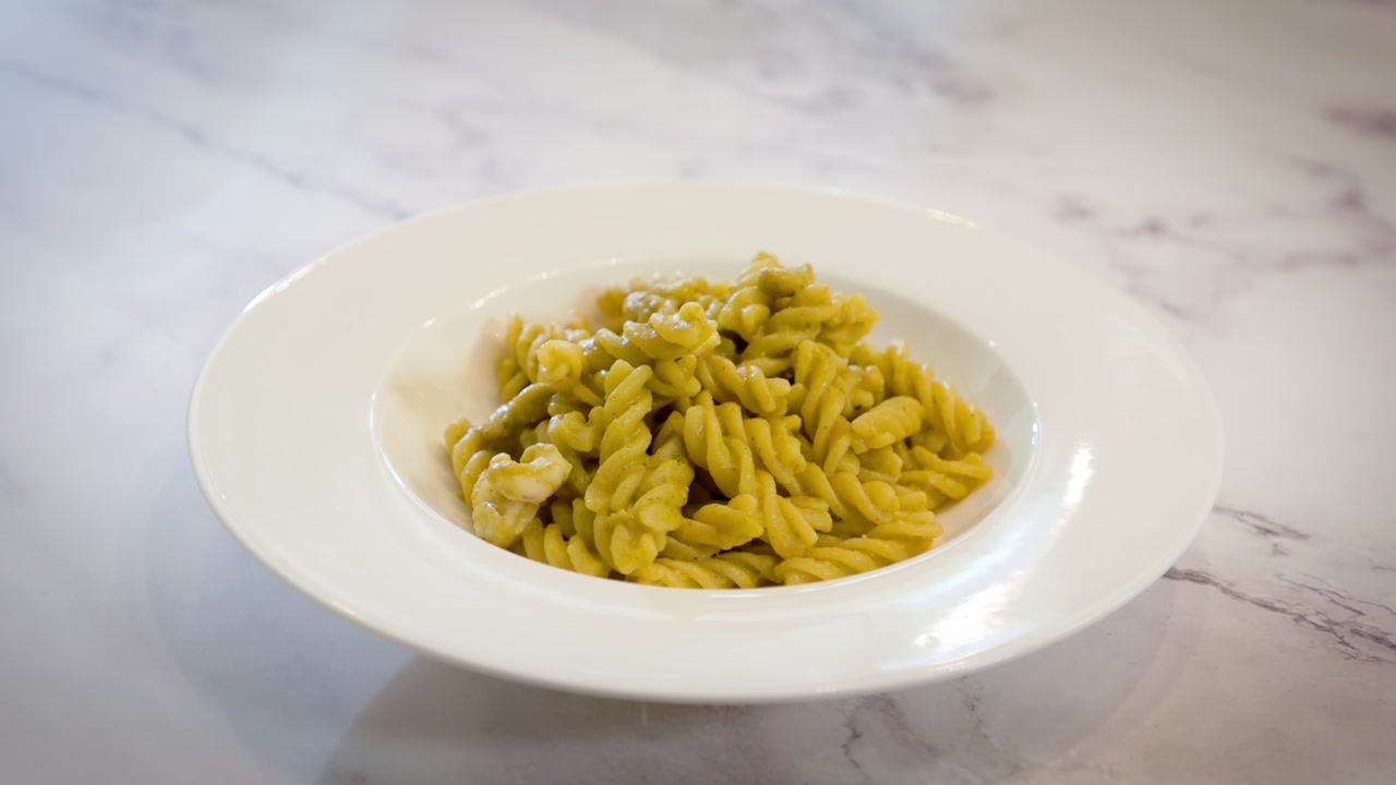 Fusilli with pink prawn, courgette and pistachio